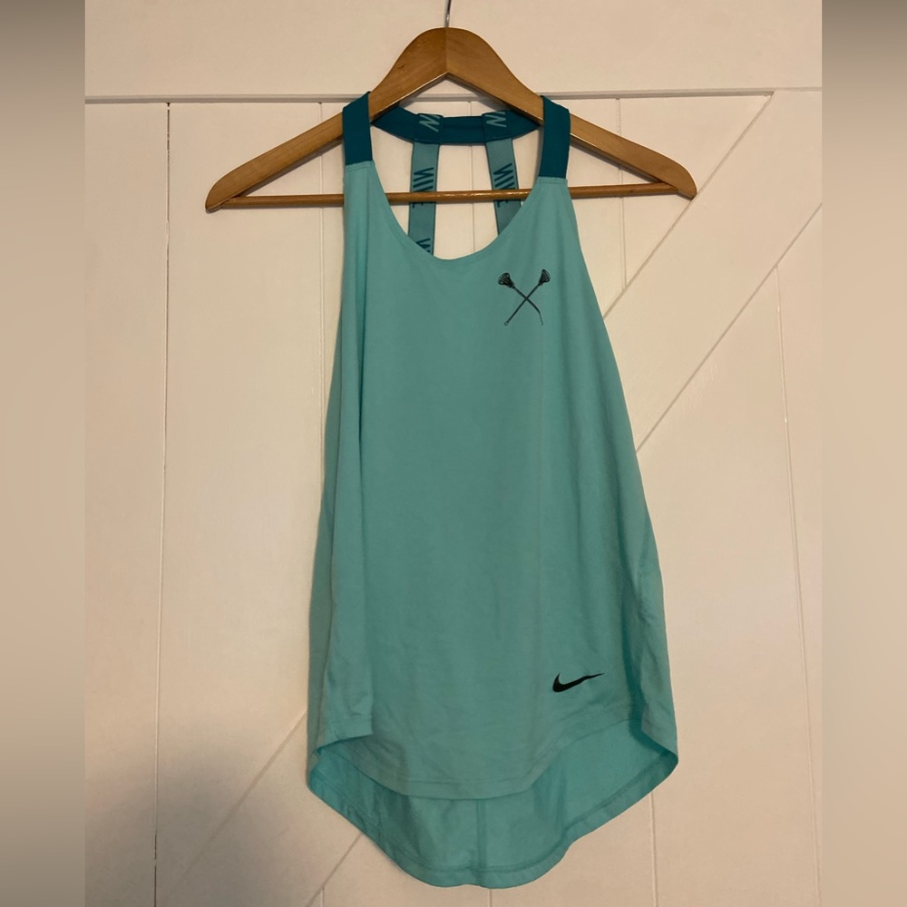 Nike women’s workout top with Lacrosse stick.